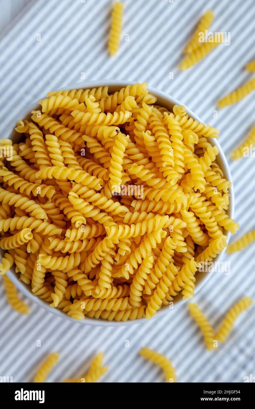Raw Dry Organic Rotini Pasta Ready to Cook. Top view, from above, flat