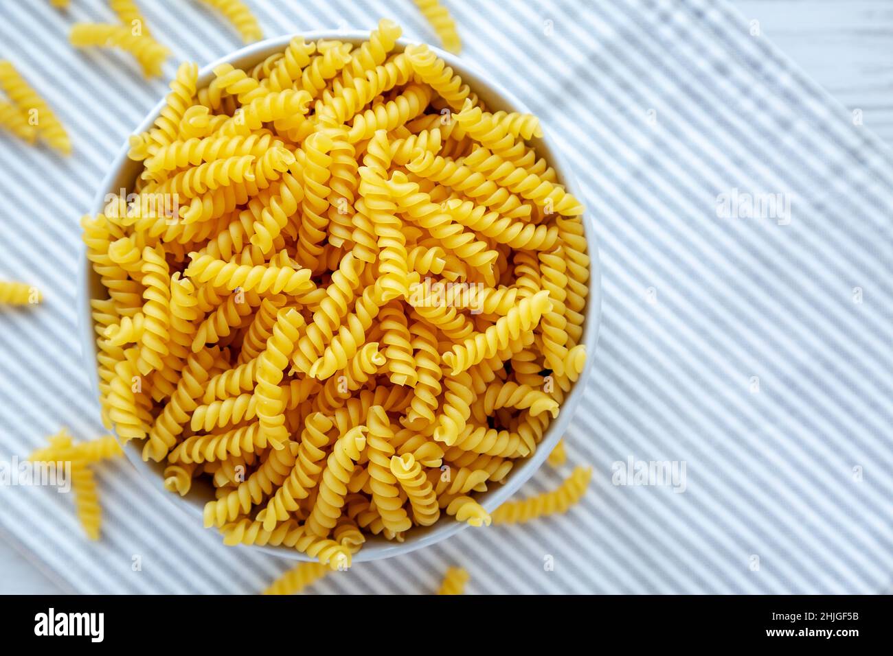 Raw Dry Organic Rotini Pasta Ready to Cook. Top view, from above, flat