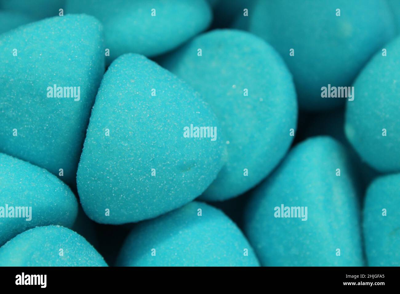 chewy bluecolored marmalade gumme shaped candy sphere truffles close