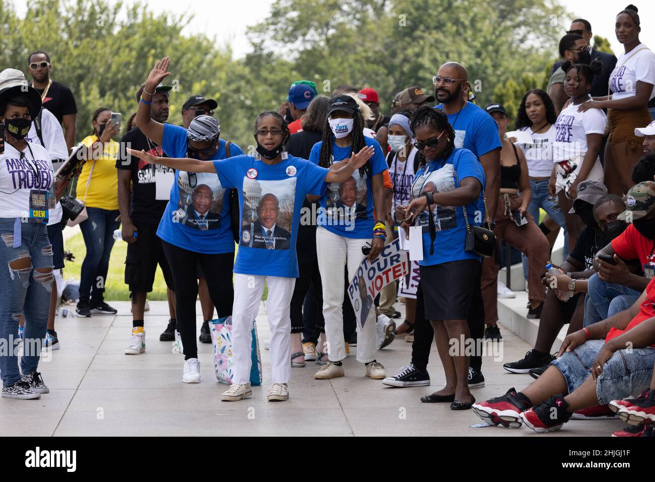 WASHINGTON, D.C. -- August 28, 2021: Demonstrators are seen during the Make Good Trouble Rally at the Lincoln Memorial. Stock Photo