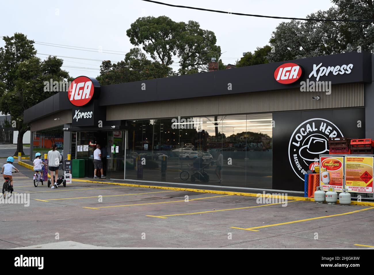 Customers entering an IGA Xpress convenience store, attached to a BP