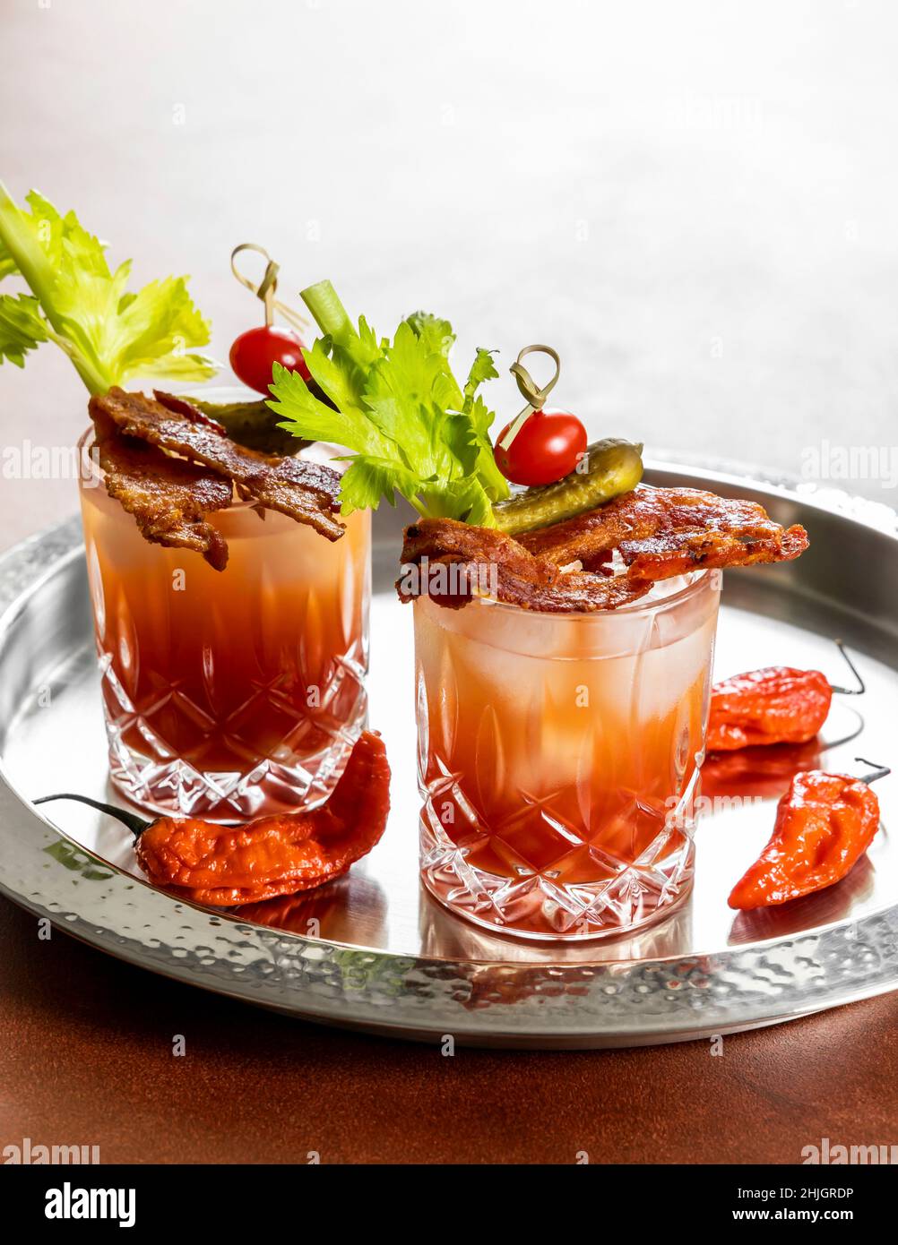 Two glasses of Bloody Mary with bacon rashers Stock Photo by Alex9500