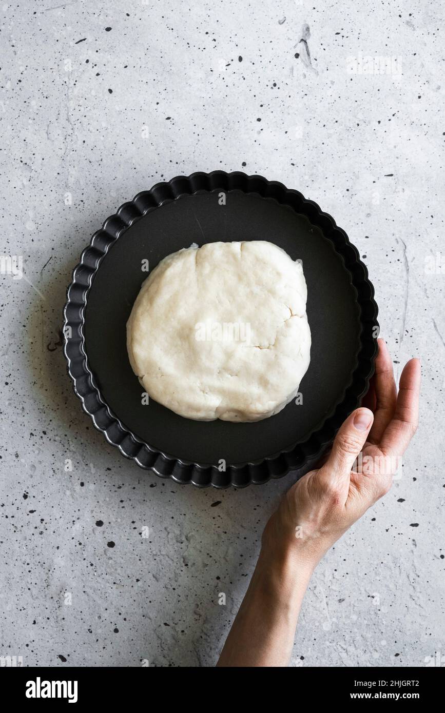 A baker making a tart shell Stock Photo