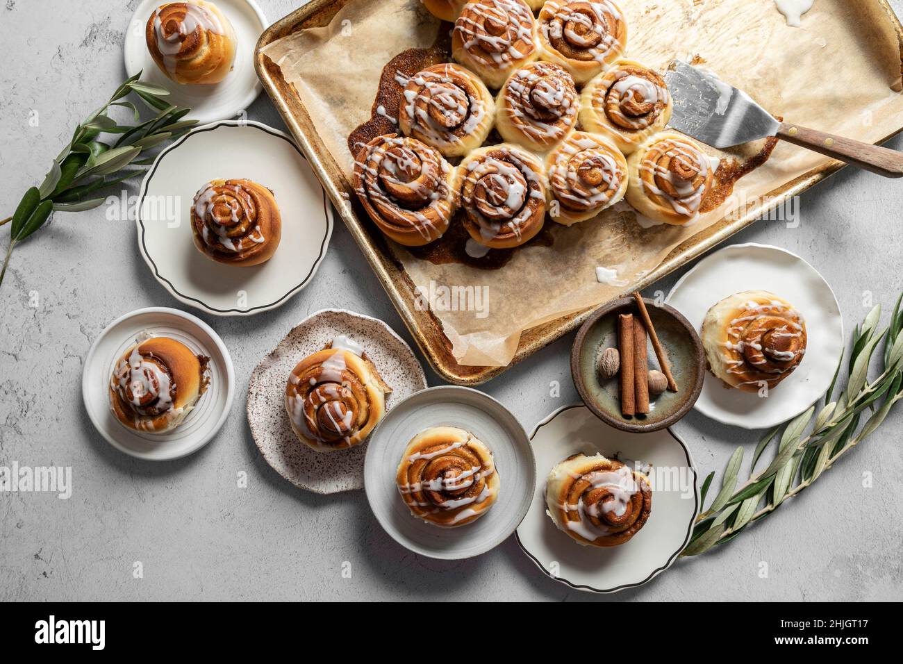 Cinnamon Roll pastries covered in drizzled icing Stock Photo - Alamy