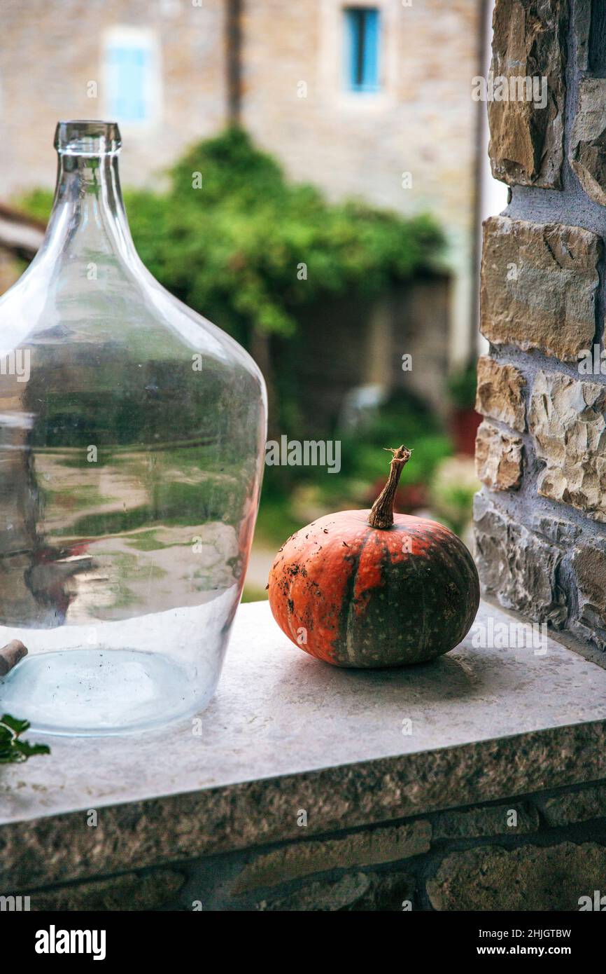 Small pumpkin outside on the wall Stock Photo