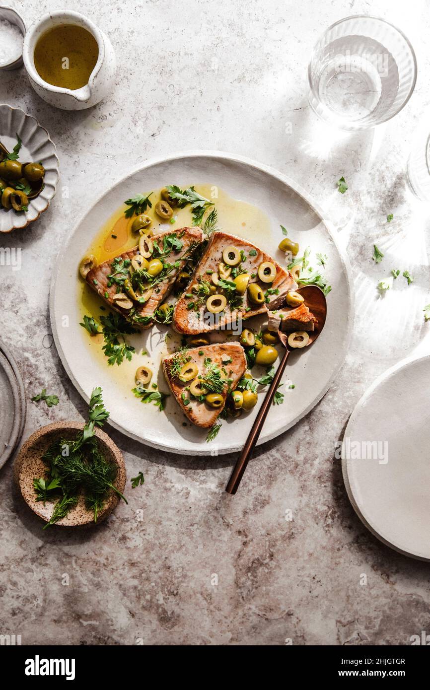 roasted tuna with olives and herbs Stock Photo