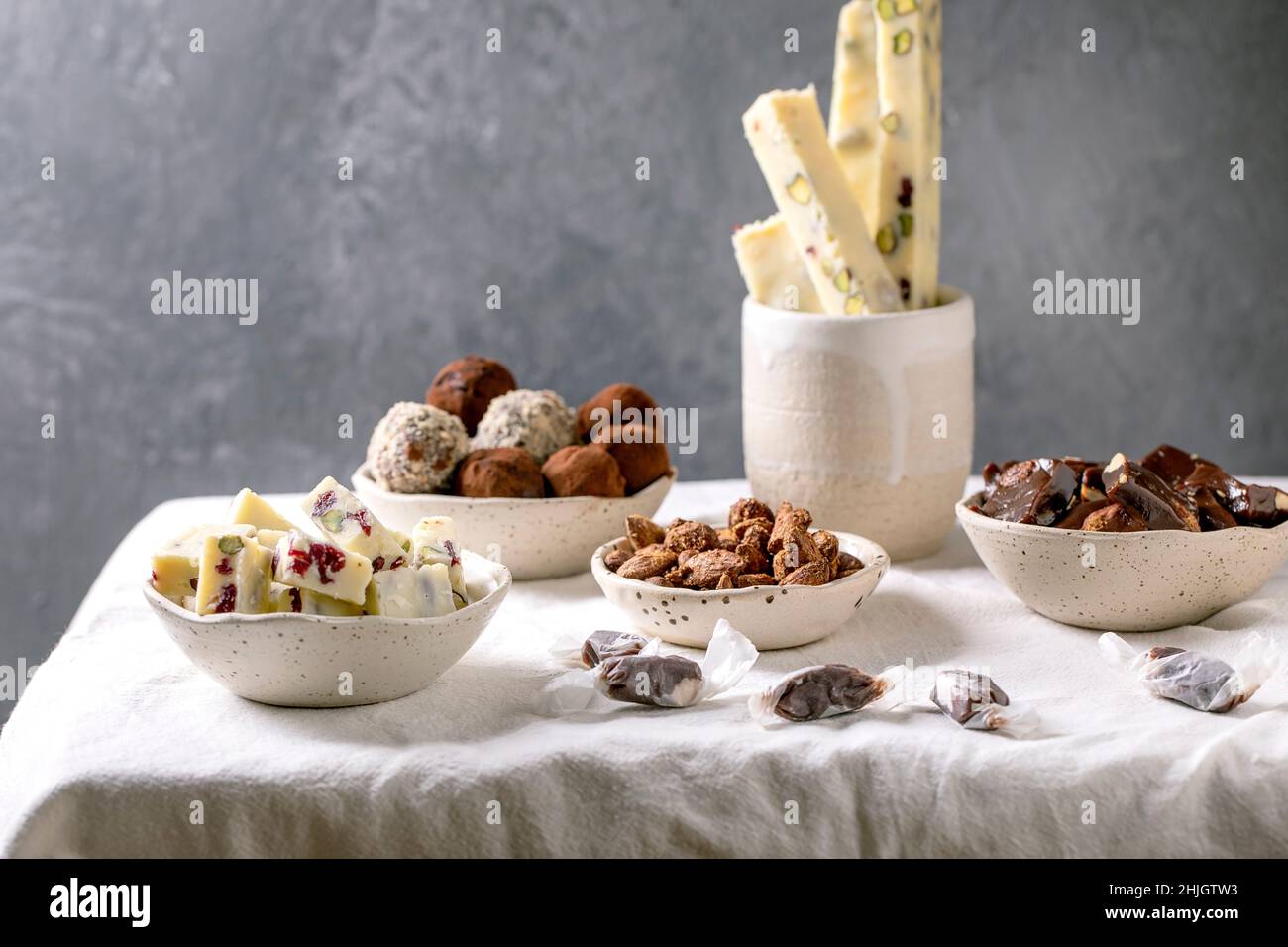 Variety of homemade toffee chocolate almond nuts candy, dark chocolate truffle, white chocolate