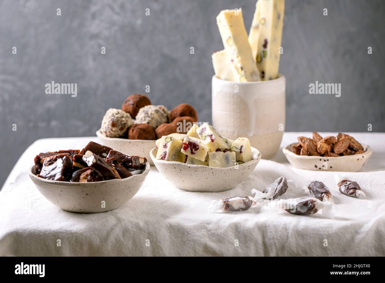 Variety of homemade toffee chocolate almond nuts candy, dark chocolate truffle, white chocolate