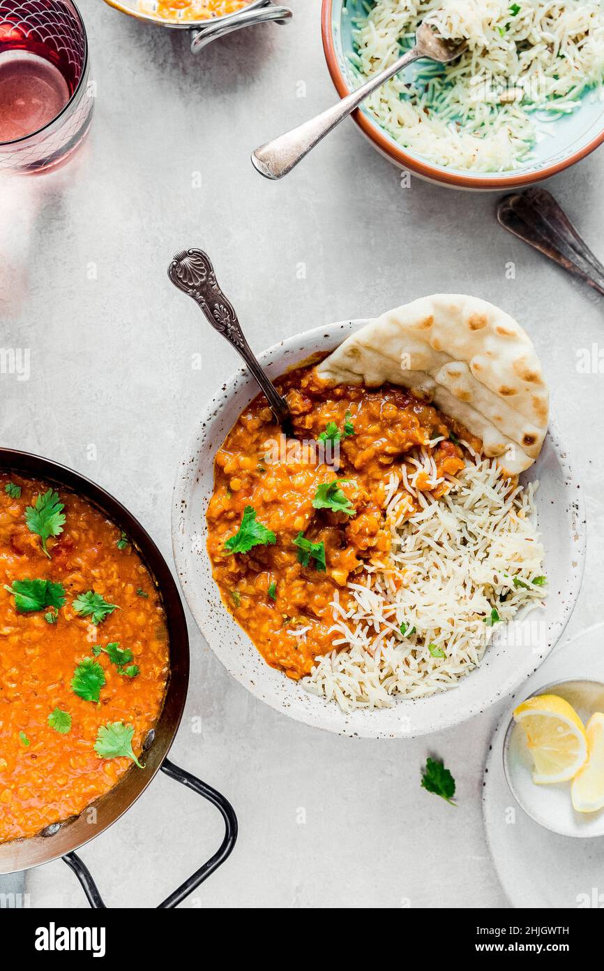 Vegan Red Lentil Dal served with cumin rice Stock Photo Alamy