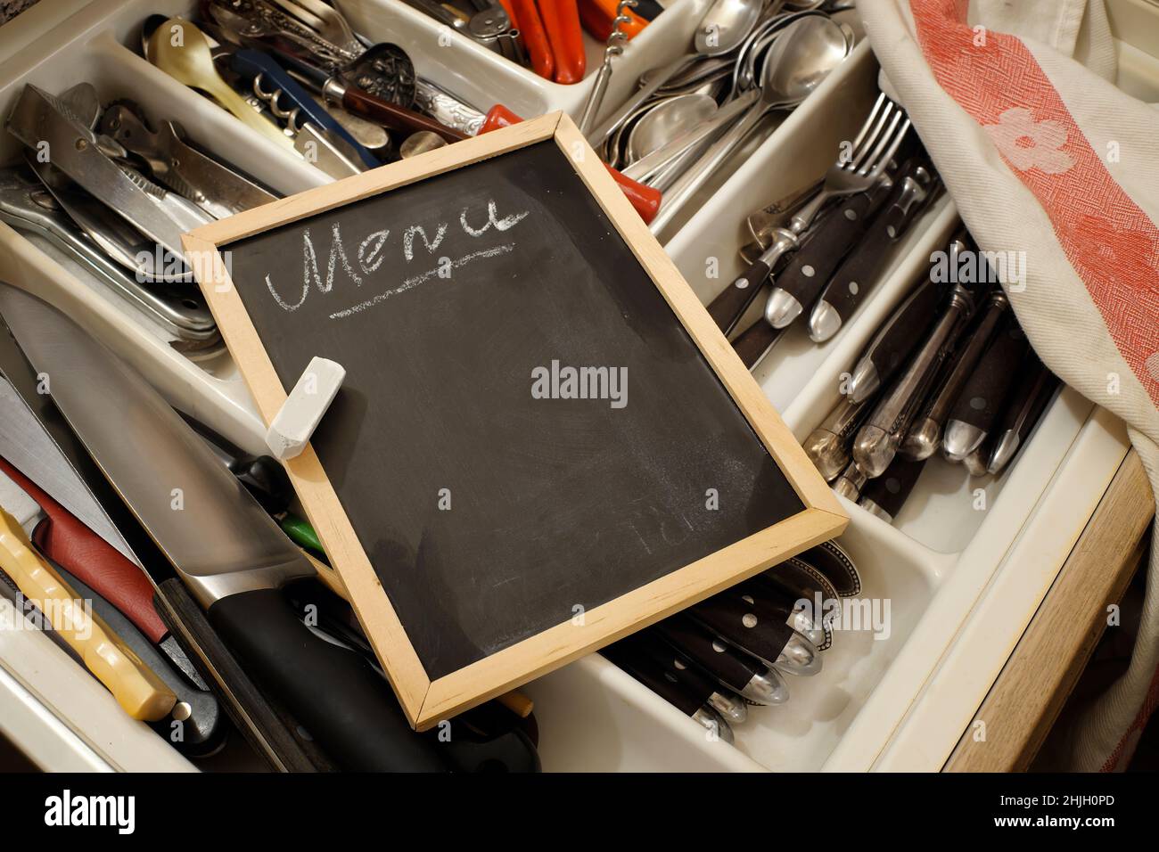 empty menu blackbord with free copy space and professional kitchen utensils.Gastronomy, food and drink occupation, business concept. Stock Photo