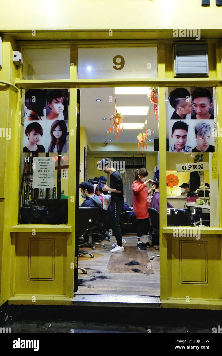 London, UK, 29th Jan, 2022. Visiting a hair salon before Chinese New Year as it is considered traditionally  to be bad luck cutting one's hair during the New Year. Elsewhere footfall in London's Chinatown increases with shoppers buying provisions for special meals and weekend diners during the run-up to Chinese New Year, which falls on February 1st. Credit: Eleventh Hour Photography/Alamy Live News Stock Photo