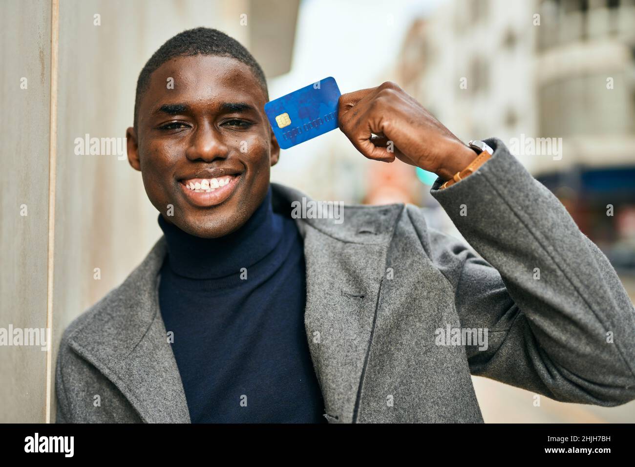 Young african american man smiling happy holding credit card at the ...