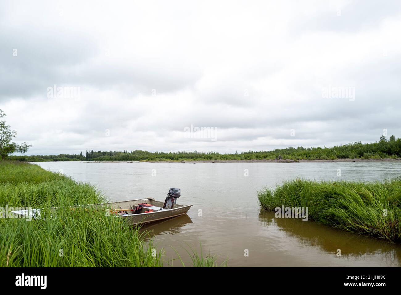 Skiff tied up on the riverbank on the Stony River. Stock Photo