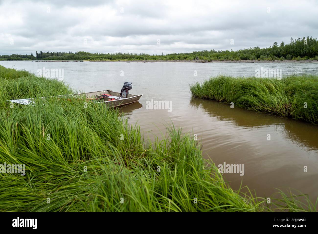 Skiff tied up on the riverbank on the Stony River. Stock Photo