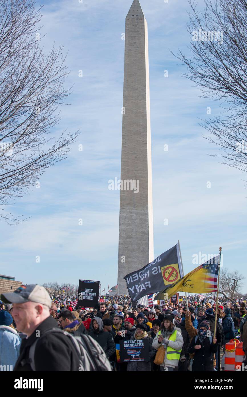 Defeat the Mandates march at Washington Monument. Demonstrators protesting mask & Covid-19 vaccination mandates.Washington, DC,Jan 23,2022 Stock Photo