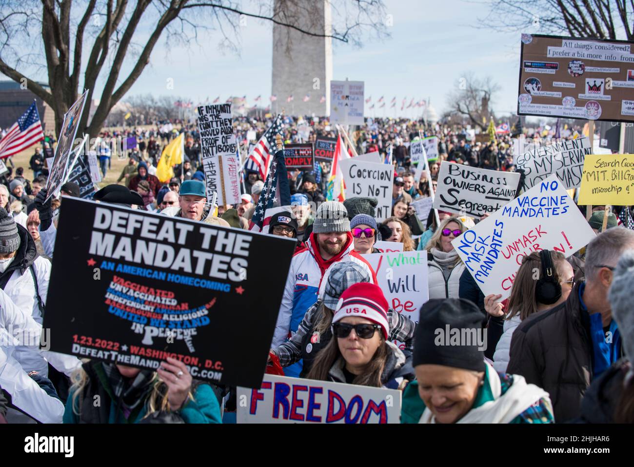 Defeat the Mandates march at Washington Monument. Demonstrators protesting mask & Covid-19 vaccination mandates.Washington, DC,Jan 23,2022 Stock Photo