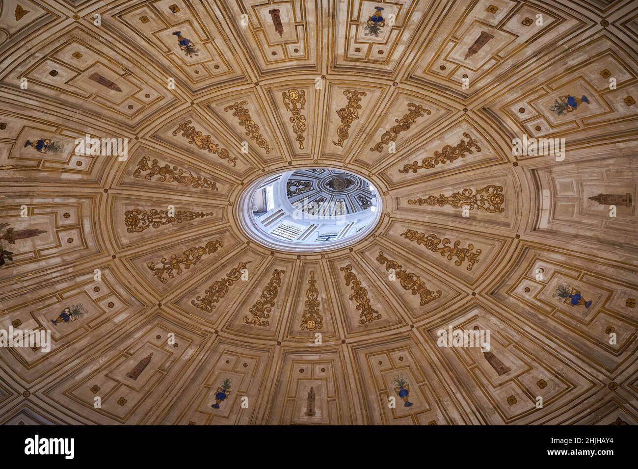 Ceiling with gold petters and artworks of the dome in the Sala Capitular Stock Photo