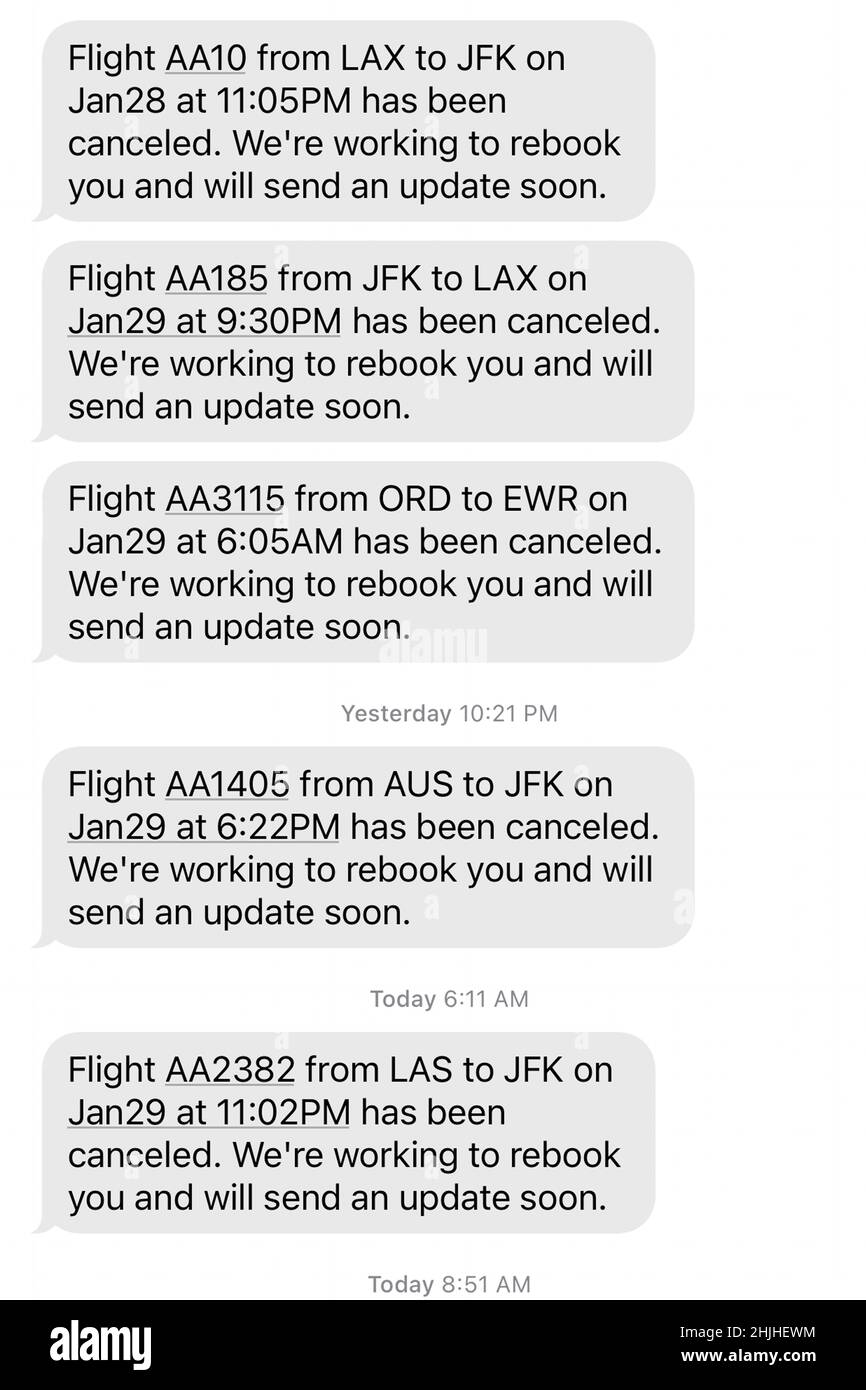 American Airlines flight cancellations to New York area airports, John F. Kennedy (JFK) and LaGuardia (LGA), amid a winter storm blizzard snow and wind advisory are displayed in text messages on an iPhone 13 Pro Max, Saturday, Jan 29, 2022, in Los Angeles. Stock Photo