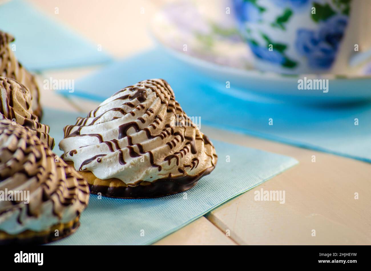 cookies with a cream tea on a blue background Stock Photo