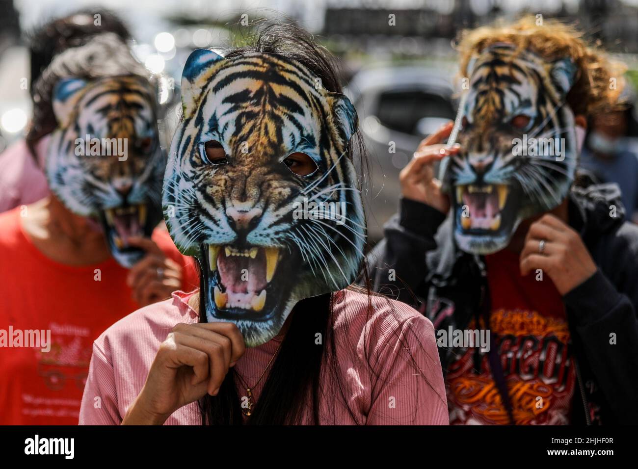 Manila, Philippines. 30th Jan, 2022. Climate activists wearing tiger masks call for a total coal phase out during a protest in celebration of the Tiger Lunar New Year at the Fil-Chinese Friendship Arch in Binondo, Manila, Philippines. January 30, 2022. The groups urged countries like China, one of the highest contributors to financing coal overseas, to act swiftly on strengthening their leadership in climate action and their development of renewable energy systems. (Credit Image: © Basilio Sepe/ZUMA Press Wire) Stock Photo