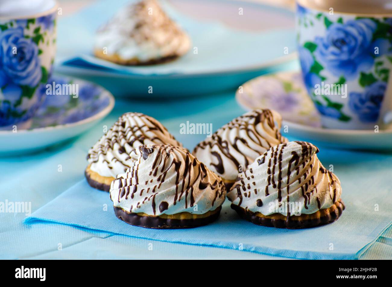 cookies with a cream tea on a blue background Stock Photo