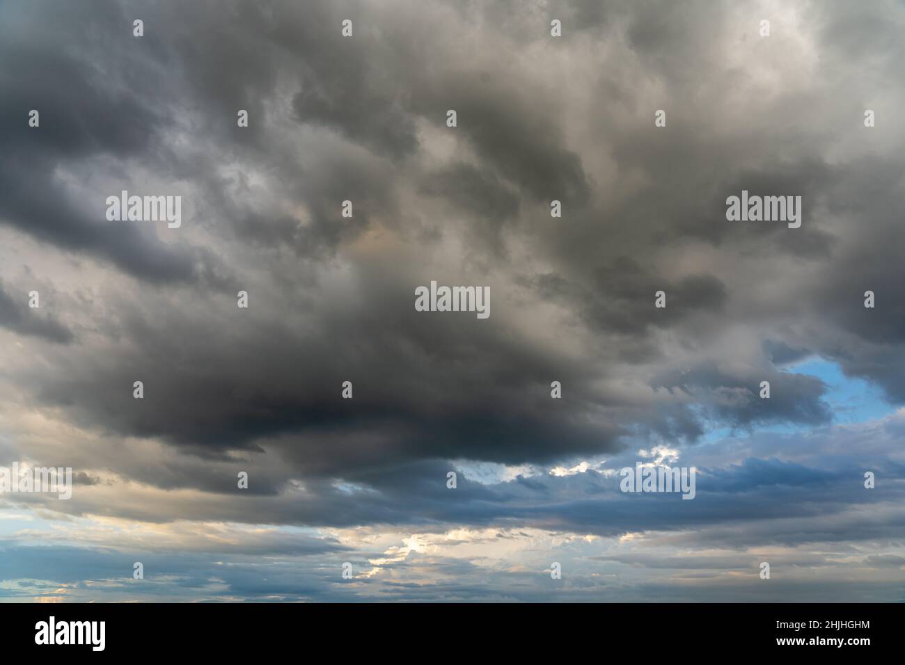 Background with blue sky and dark storm cumulus clouds hi-res stock ...