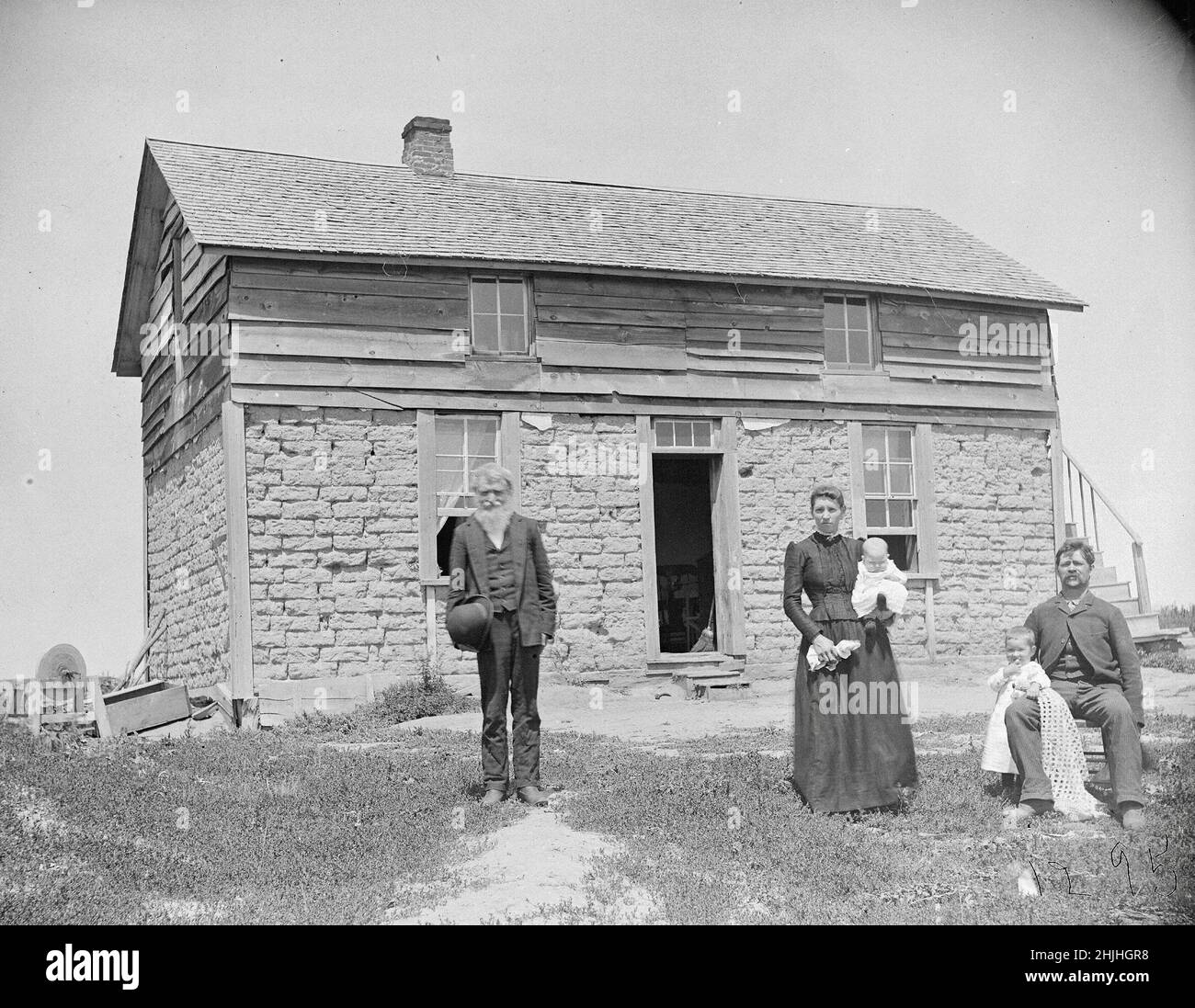 Soloman D Butcher photographs - The Frederic Schreyer house in Custer County. The two-story home has a sod and a wooden upper level. Stock Photo