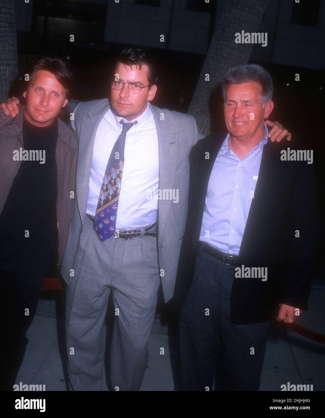 Beverly Hills, California, USA 21st May 1996 (L-R) Actor Emilio Estevez, actor Charlie Sheen and father Actor Martin Sheen arrive at 'The Arrival' Premiere at The Academy Theatre on May 21, 1996 in Beverly Hills, California, USA. Photo by Barry King/Alamy Stock Photo Stock Photo