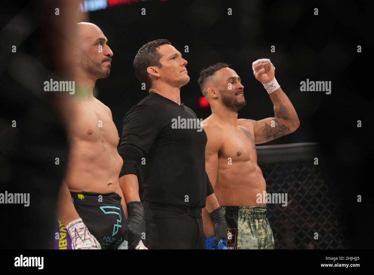 Phoenix, Az, United States. 29th Jan, 2022. PHOENIX, AZ - JANUARY 29: (R-L) Chris Gonzalez celebrates his victory over Saad Awad in their lightweight fight during the Bellator 273: Bader v Moldavsky event at Footprint Center, on January 29, 2022 in Phoenix, AZ, United States. (Photo by Louis Grasse/PxImages) Credit: Px Images/Alamy Live News Stock Photo