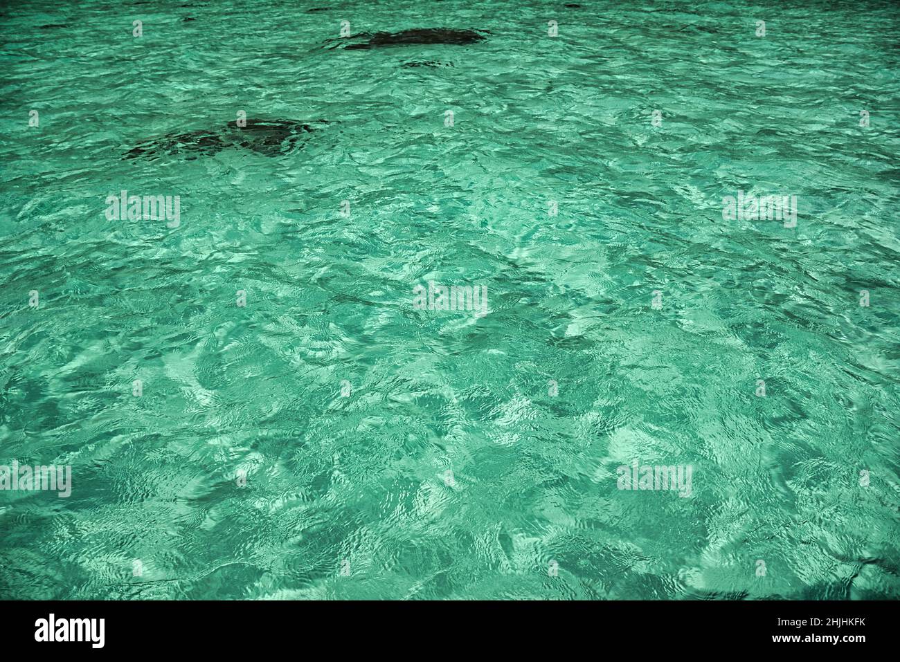 Turquoise crystal clear water on the shores of the magical island Koh Lipe Stock Photo