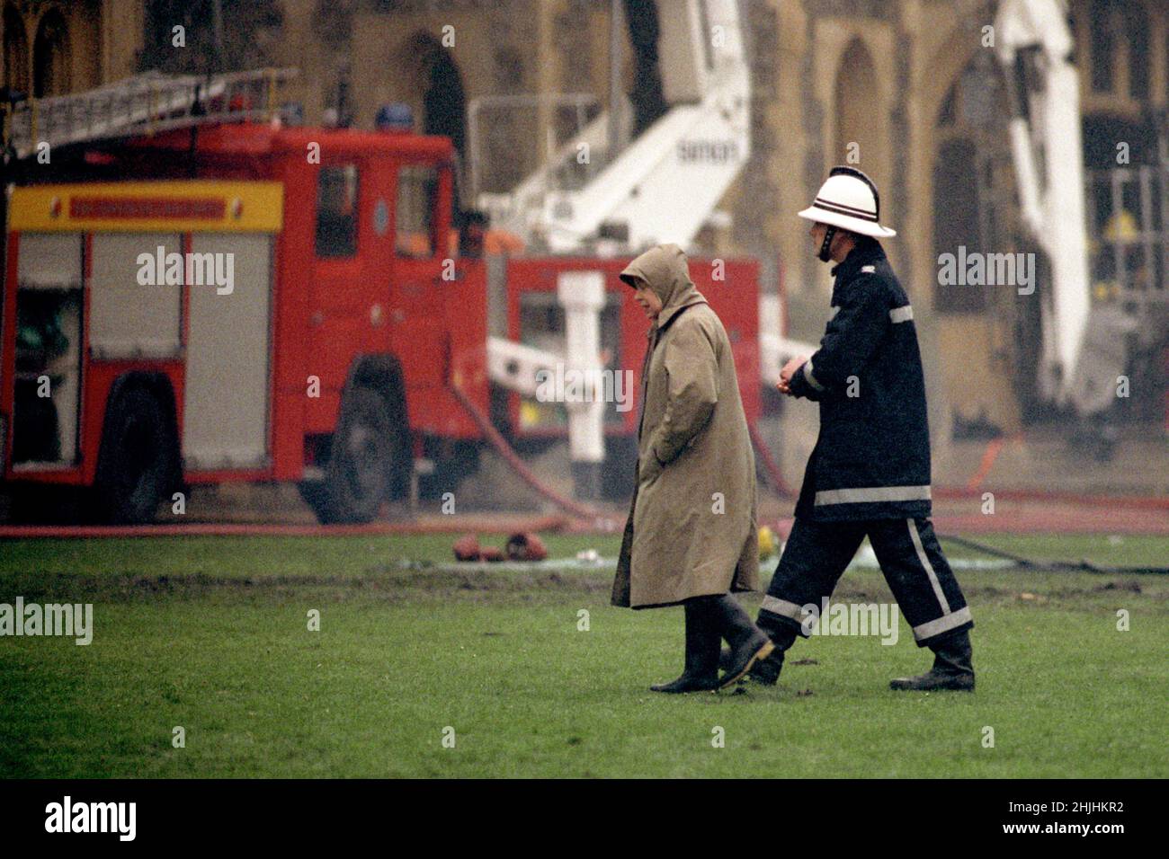 File photo dated 21/11/92 of Queen Elizabeth II surveying the scene at Windsor Castle following the fire. Issue date: Sunday January 30, 2022. Stock Photo