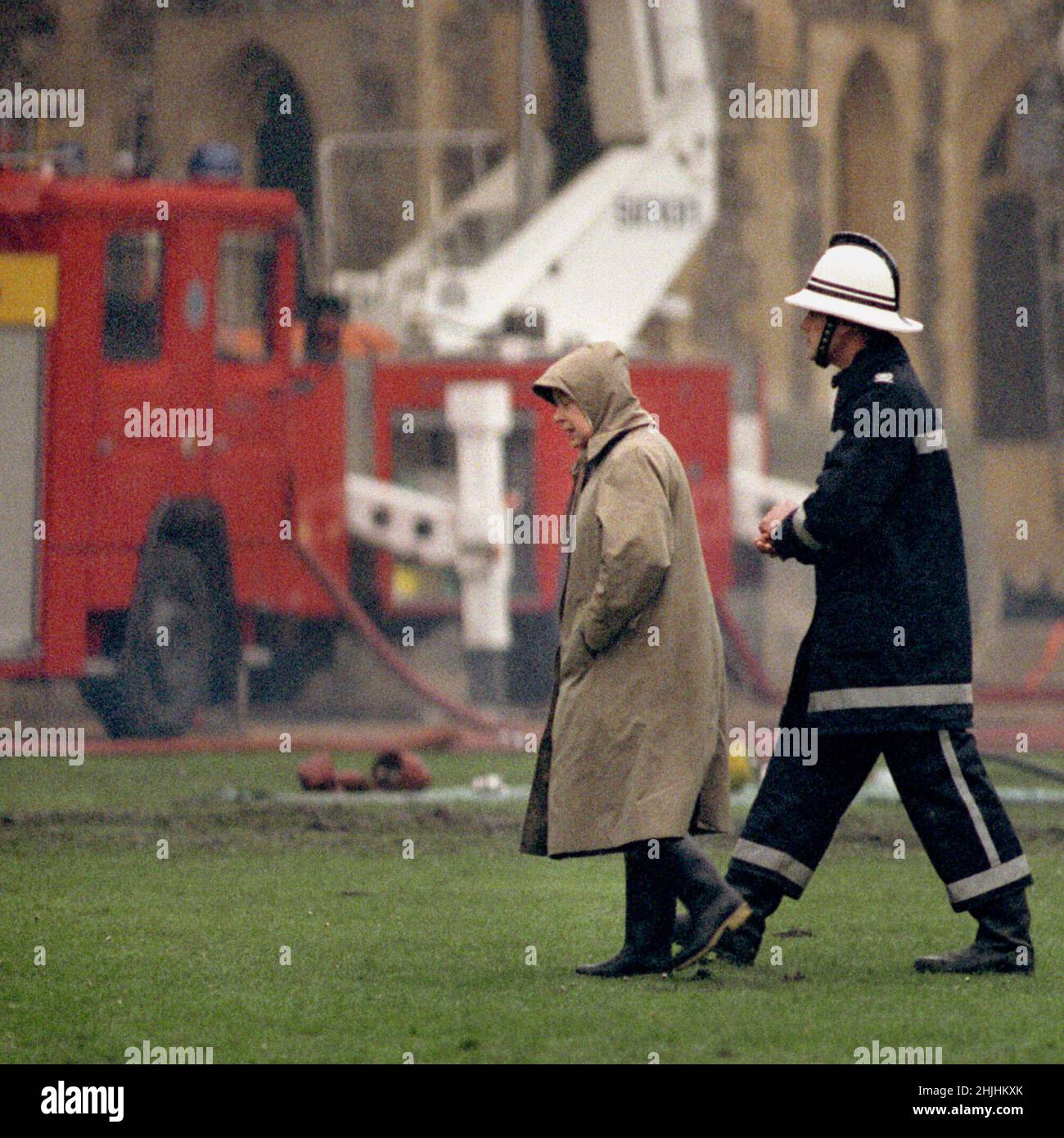 File photo dated 21/11/92 of Queen Elizabeth II surveying the scene at following the fire at Windsor Castle. Issue date: Sunday January 30, 2022. Stock Photo