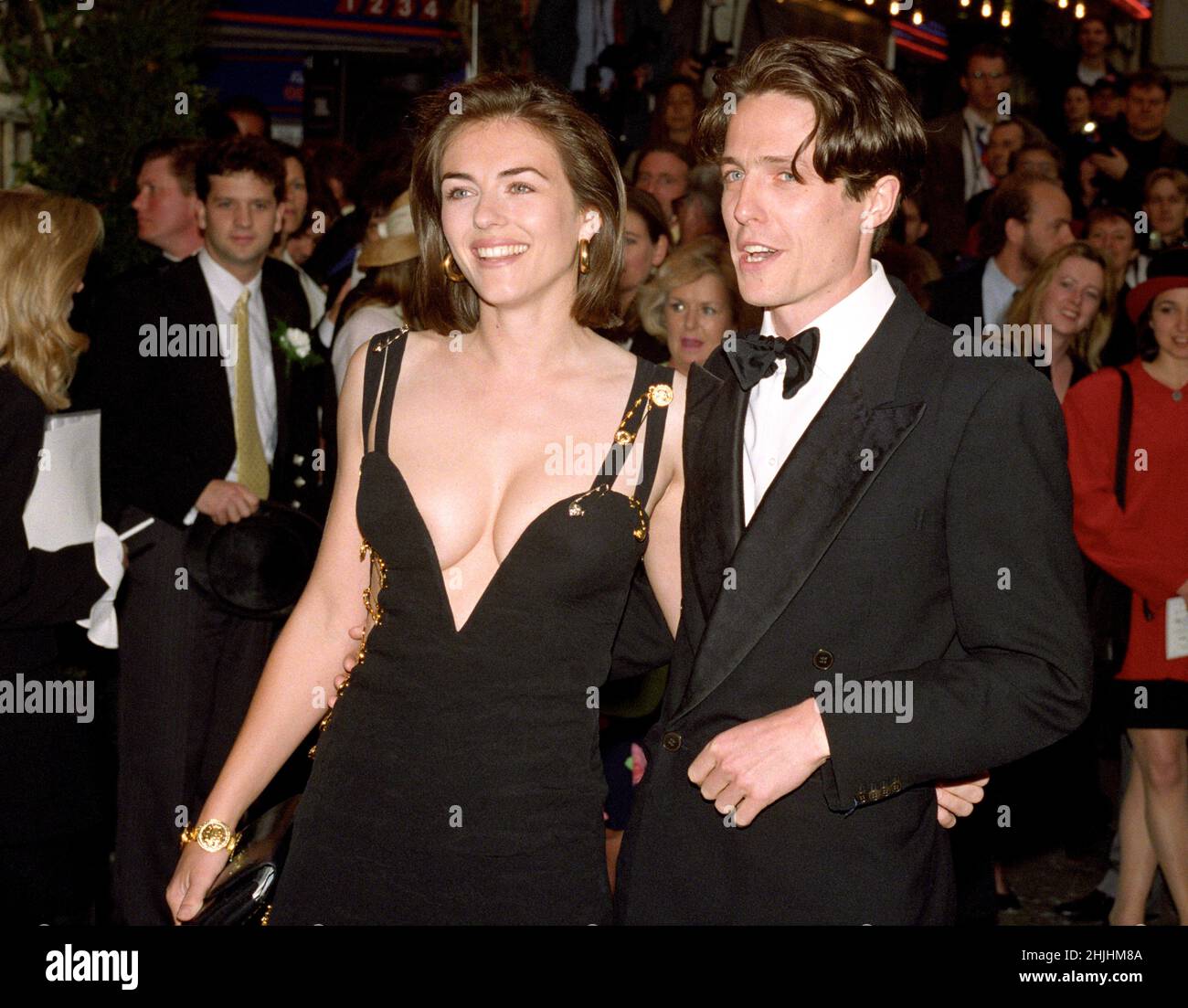 1994: File photo dated May 1994 of actor Hugh Grant and his actress girlfriend Elizabeth Hurley arriving for the charity premiere of 'Four Werddings and a Funeral' in which he stars. Issue date: Sunday January 30, 2022. Stock Photo