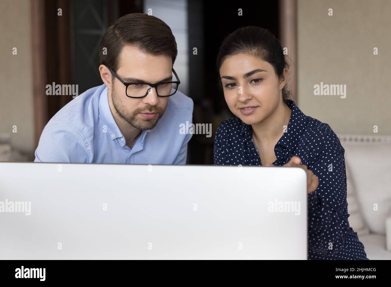 Focused multiracial business people working on computer. Stock Photo