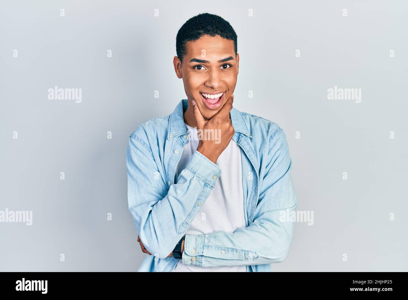 Young african american guy wearing casual clothes looking confident at ...