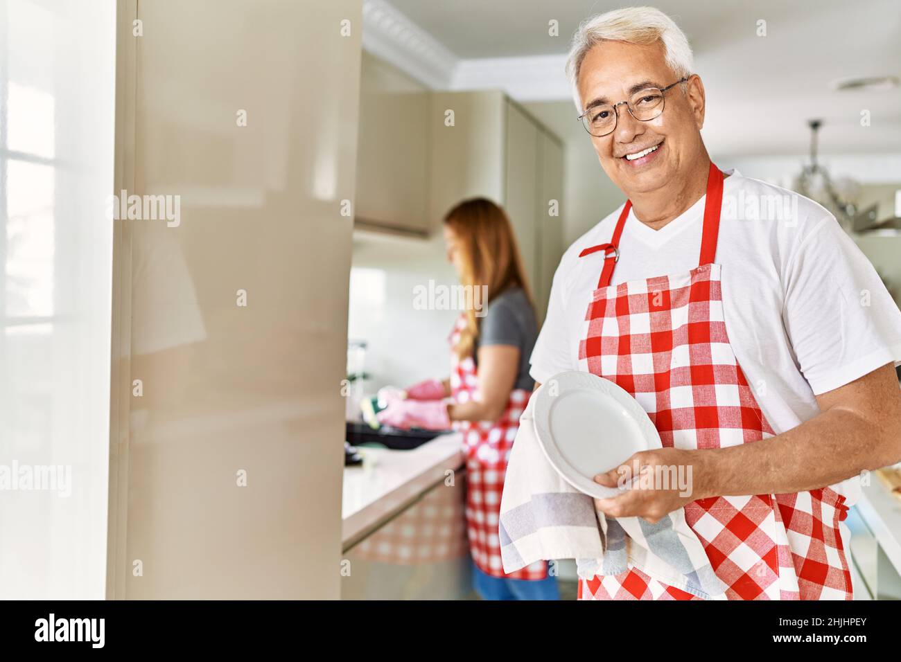 Portrait man washing dishes in hi-res stock photography and images - Alamy