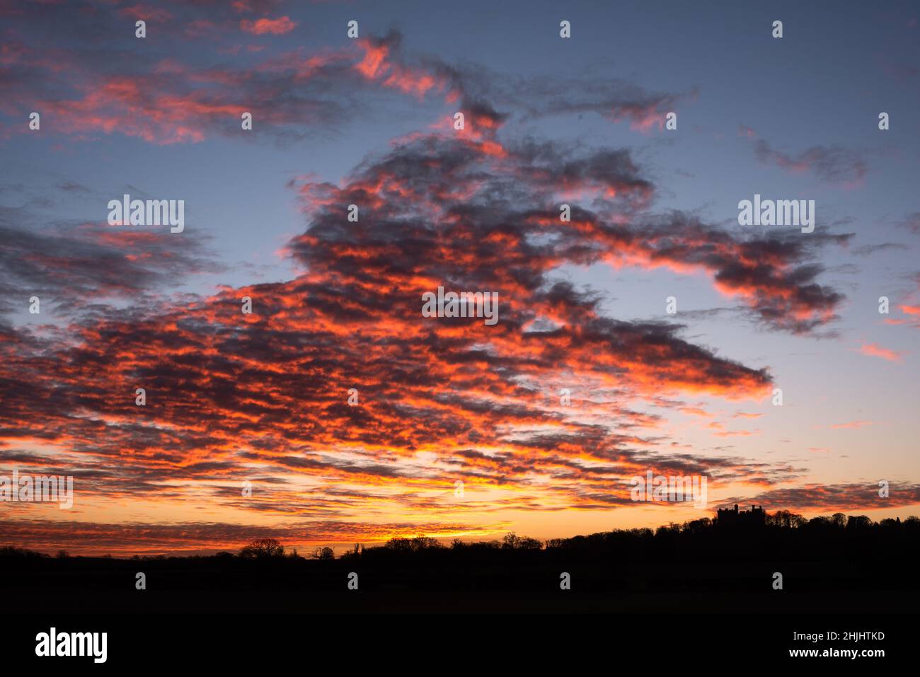 Belvoir Castle, Leicestershire, UK. 30th Jan 2022. The sunrise over Belvoir Castle, Leicestershire, Neil Squires/Alamy Live News Stock Photo