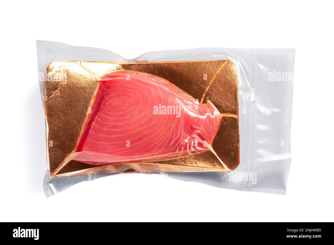 Fresh tuna fillet vacuum packed. Fish steak on a white background. Red