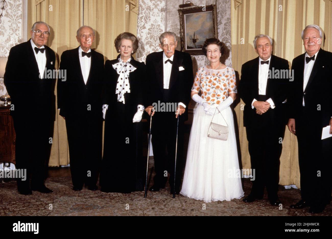 File photo dated 4/12/1985 of Margaret Thatcher joined by Queen Elizabeth II and five former PMs at 10 Downing Street, London, as the PM hosted a dinner celebrating the 250th anniversary of the residence becoming the London home of Prime Ministers. (L-R) James Callaghan, Lord Home, Harold Macmillan, MargaretThatcher, Lord Stockton, the Queen, Lord Wilson and Edward Heath. Issue date: Sunday January 30, 2022. Stock Photo