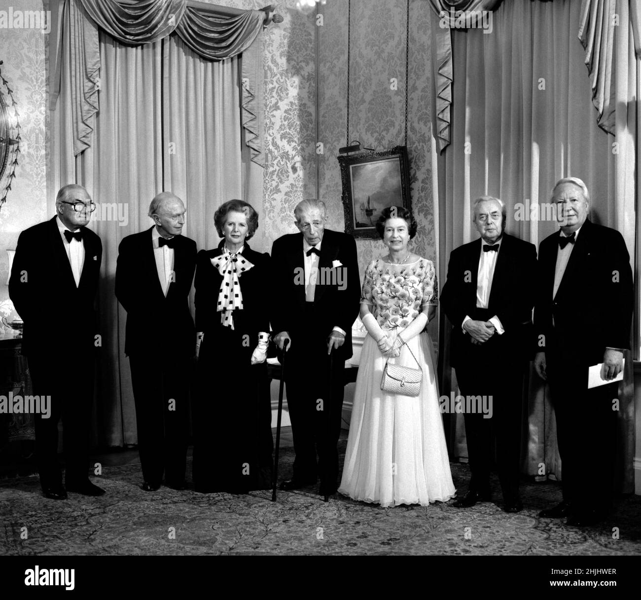 File photo dated 4/12/1985 of Margaret Thatcher joined by Queen Elizabeth II and five former PMs at 10 Downing Street, London, as the PM hosted a dinner celebrating the 250th anniversary of the residence becoming the London home of Prime Ministers. (L-R) James Callaghan, Lord Home, Harold Macmillan, MargaretThatcher, Lord Stockton, the Queen, Lord Wilson and Edward Heath. Issue date: Sunday January 30, 2022. Stock Photo