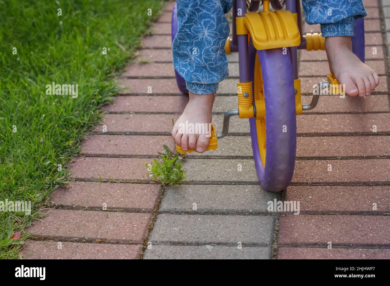Girl cycling barefoot hires stock photography and images Alamy