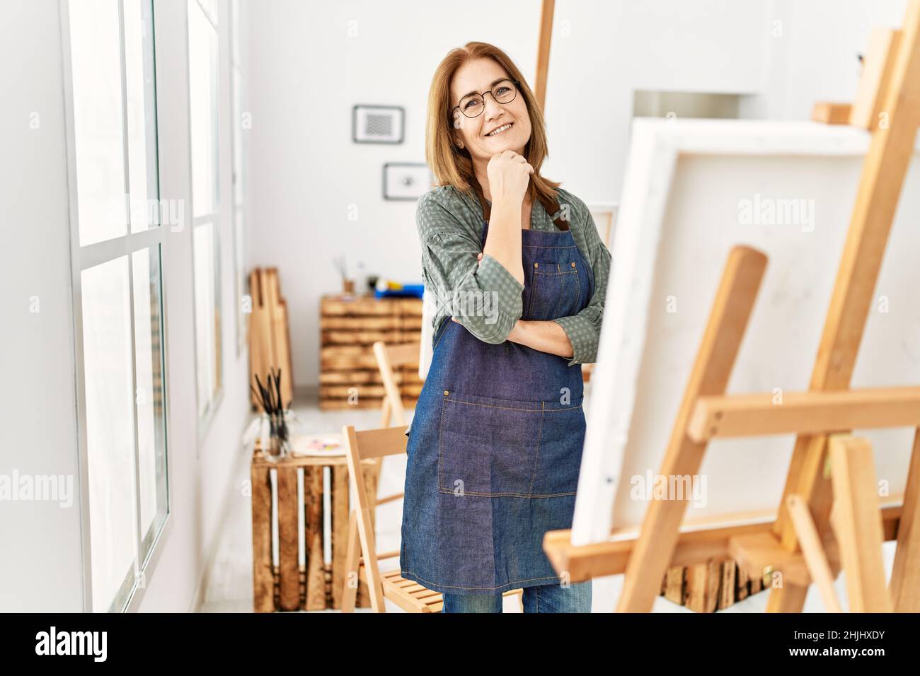 Middle age artist woman smiling happy painting at art studio Stock ...