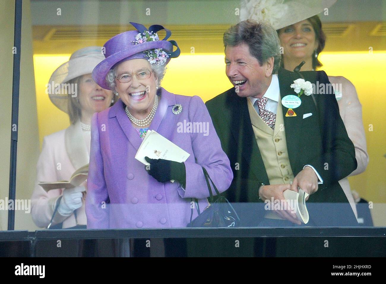 File photo dated 20/6/2013 of Queen Elizabeth II with her racing manager John Warren after her horse, Estimate, won the Gold Cup on day three of the Royal Ascot meeting at Ascot Racecourse, Berkshire. More than any other interest, horses and ponies have been the Queen's passion throughout her long life. Issue date: Sunday January 30, 2022. Stock Photo