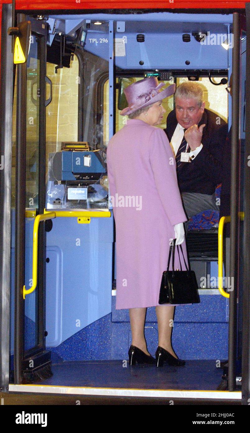 File photo dated 6/6/2002 of Queen Elizabeth II talking with bus driver Tony Farrell as she looks round a double decker bus in Willesden bus garage North London as part of her Golden Jubilee tour of the UK. Issue date: Sunday January 30, 2022. Stock Photo