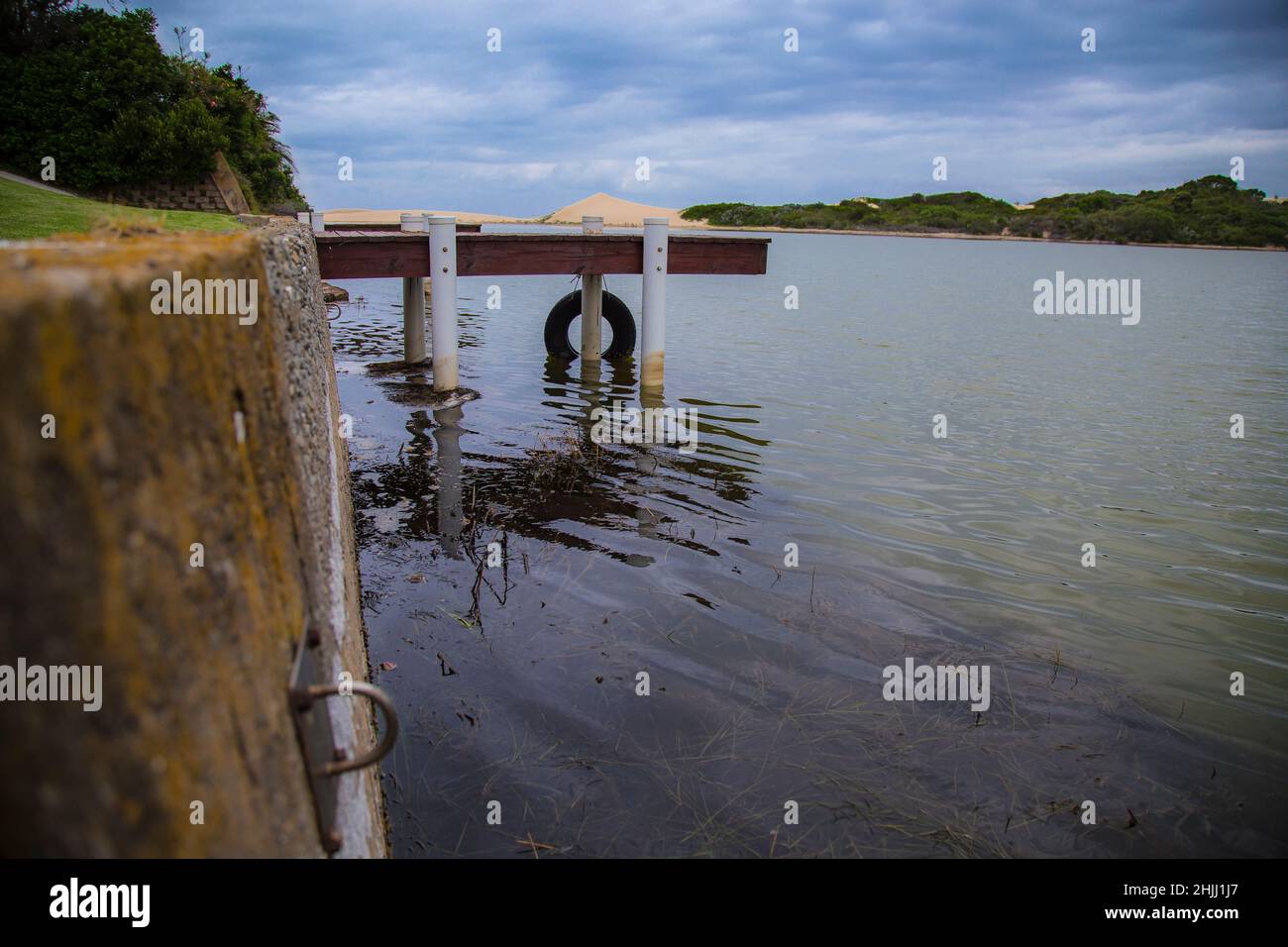 Docking Jetty on a quiet and still river. Stock Photo