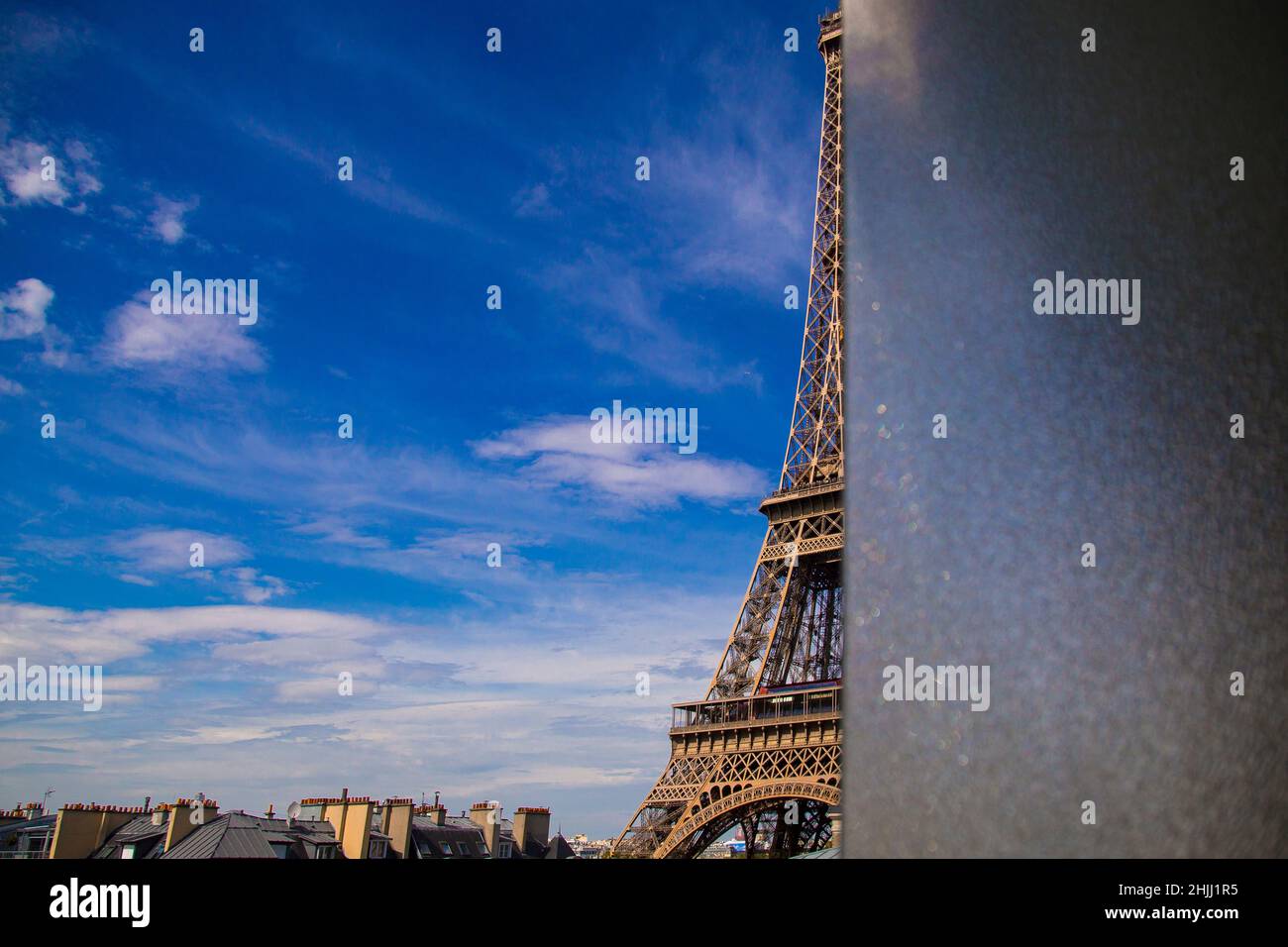 Hidden Eiffel Tower peering around a screen. Stock Photo