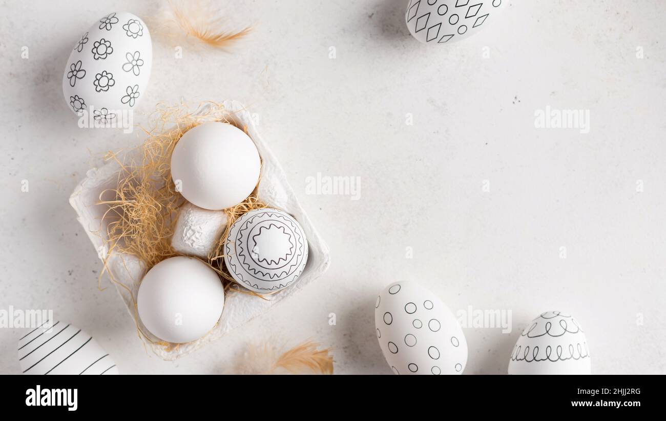 Simple Easter eggs with different pattern and feathers Stock Photo