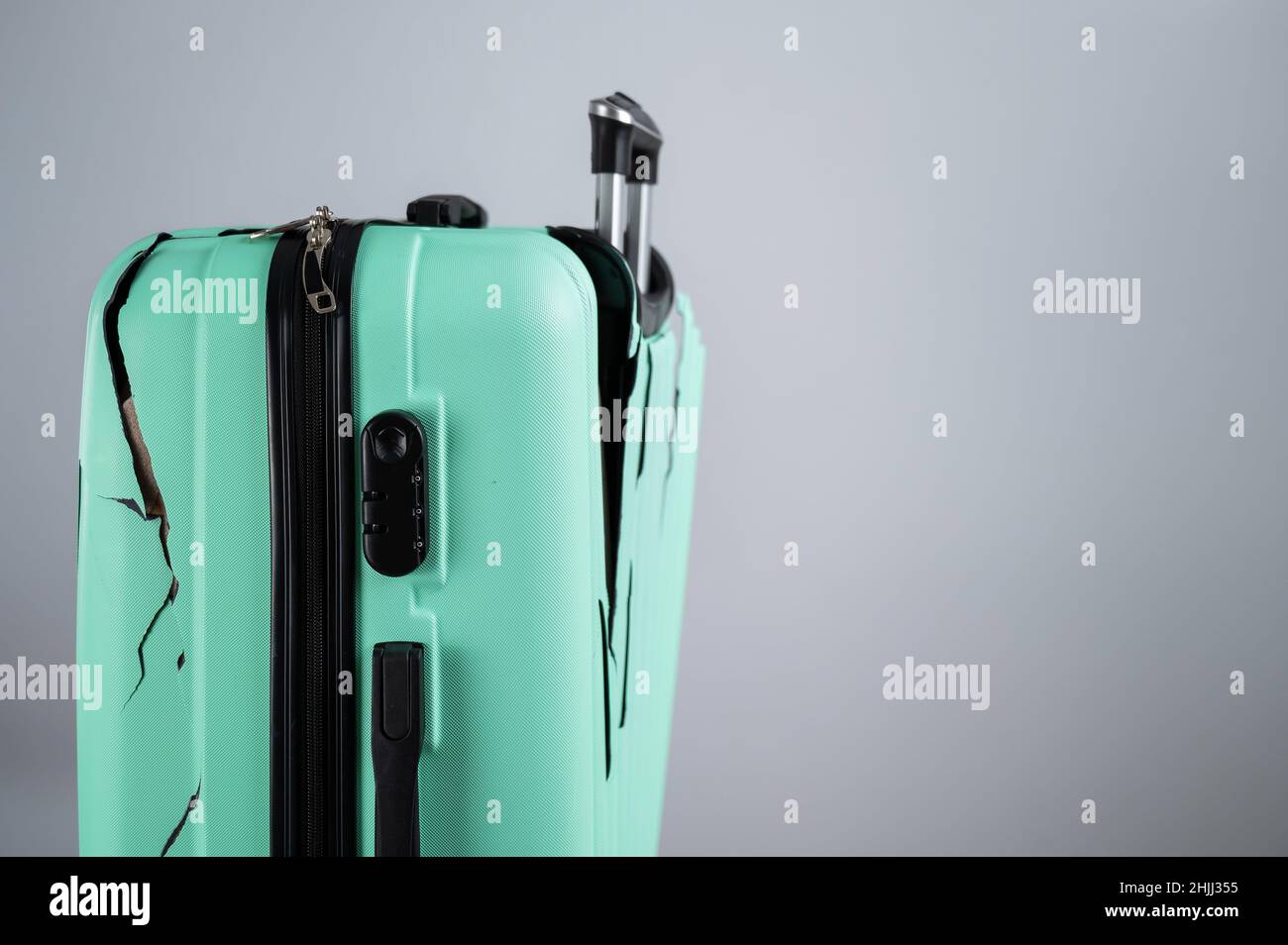 Close-up of a broken plastic suitcase on a white background Stock Photo ...