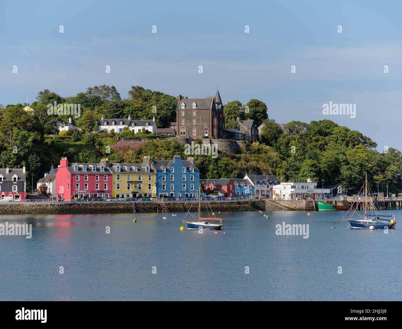 The summer harbour waterfront of Tobermory on the Isle of Mull in the Inner Hebrides, Argyll & Bute Scotland UK - summertime tourism minimal focus Stock Photo