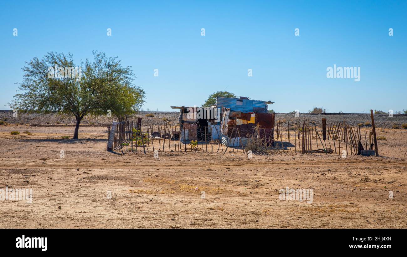 A lonely house in the middle of the desert made of colored metal sheets, Hardap region, Namibia. Stock Photo